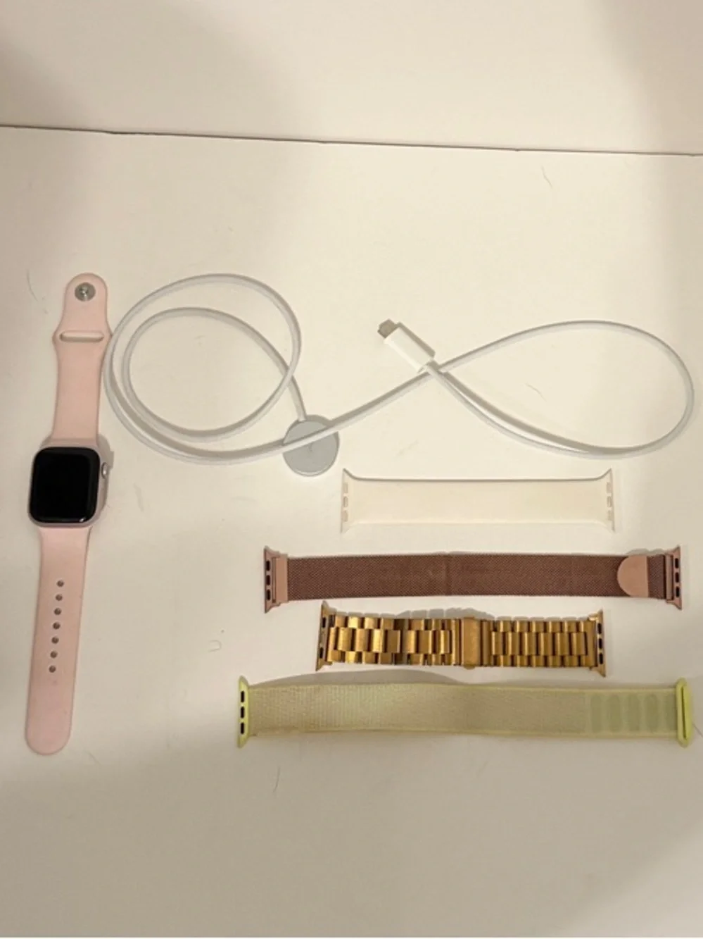Apple Smartwatch with Light Pink Sport Band, 4 Extra Bands, and charger